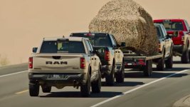 Mysterious 2025 Ram 1500 Rebel in what appears to be Mojave Sand. (Ram). - 1.jpeg