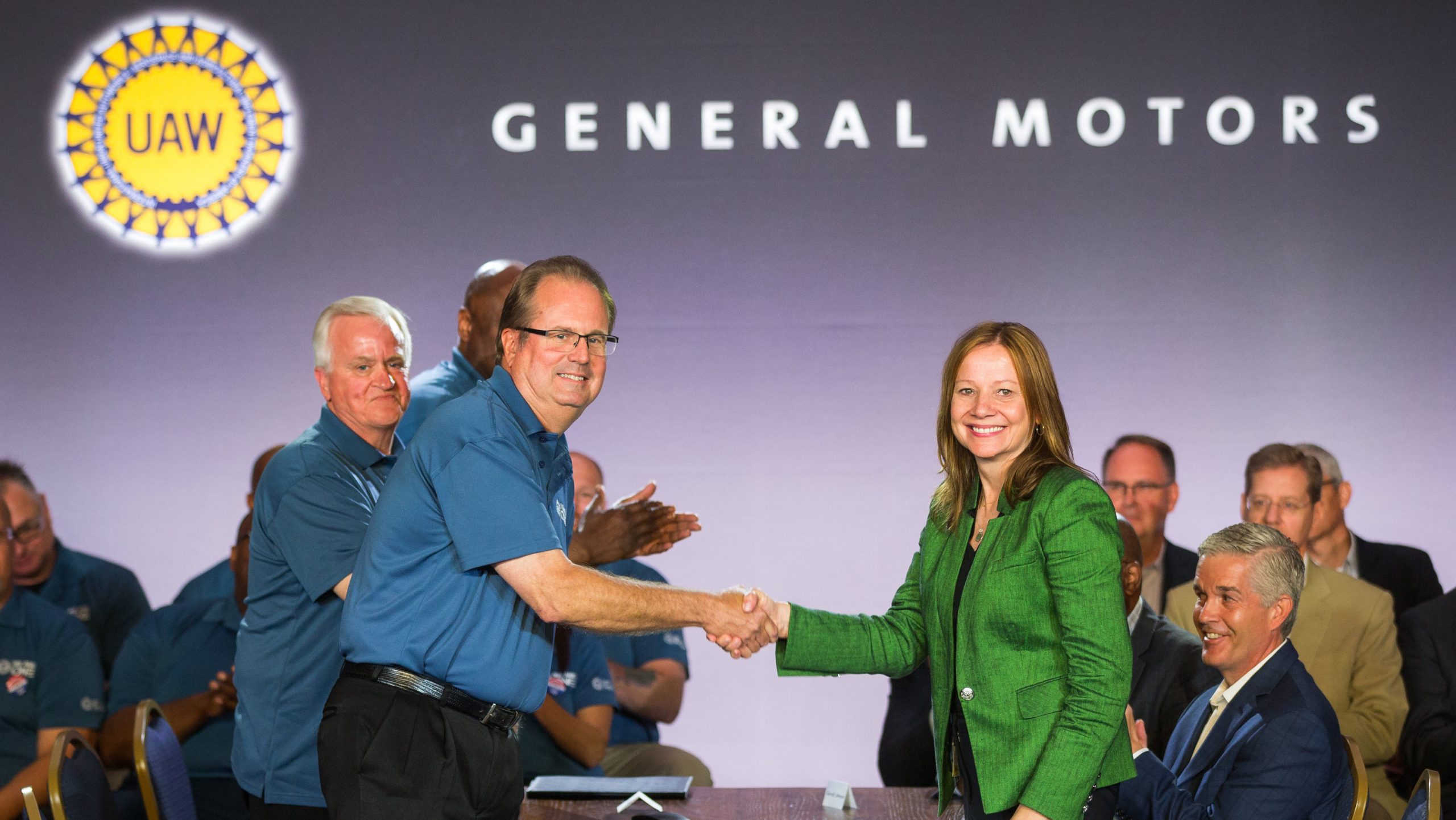 Former United Auto Workers President Gary Jones (left), and General Motors Chairman and CEO Mary Barra shake hands to open contract negotiations Tuesday, July 16, 2019. (GM).